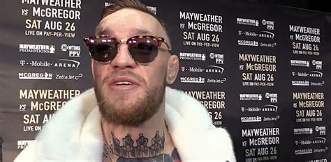 CONOR McGREGOR SHOWS OFF CUSTOM MADE VERSACE .